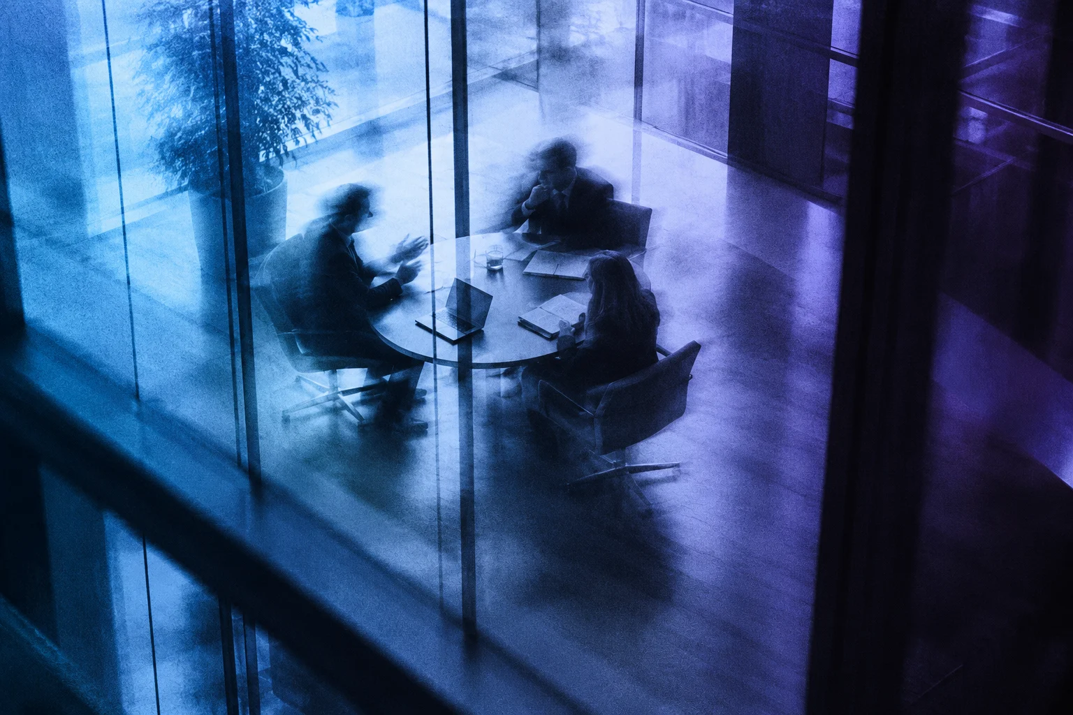 Motion-blurred business meeting in Growency blue and violet